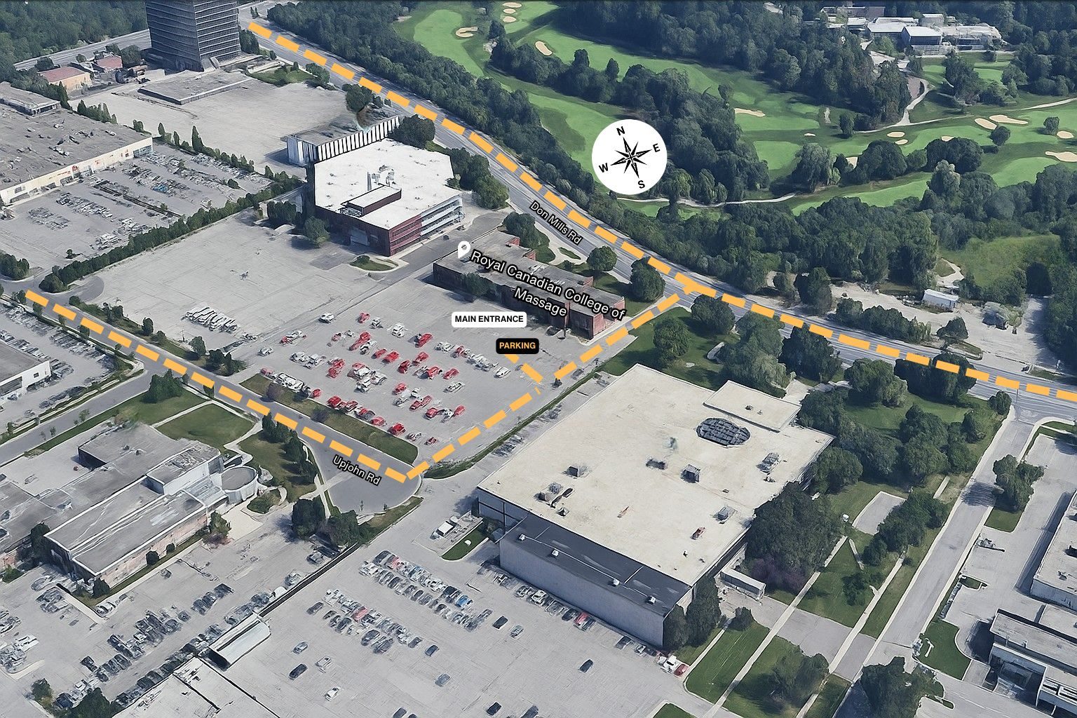 Aerial view of 1446 Don Mills Rd showing the driveways from Don Mills Rd and Upjohn Rd, the parking lot and the main entrance